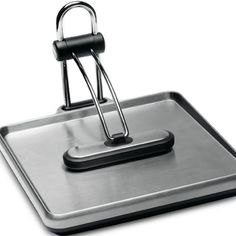 a metal square with a handle on it