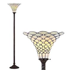 a lamp that is next to a light on a pole in the shape of a flower