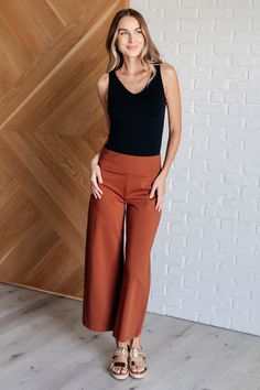 These Magic Wide Leg Crop Pants are made from a high stretch ponte knit fabric for ultimate comfort. The cropped, wide leg design adds a trendy touch, while the faux welt pocket adds a touch of sophistication. Perfect for any occasion, these pants provide both style and comfort. Ponte Knit High Stretch Cropped Wide Leg Faux Welt Pocket 65% Rayon 30% Nylon 5% Spandex True to Size S: Waist 28" Hips 38" Rise 11.5" Inseam 26"M: Waist 30" Hips 40" Rise 11.5" Inseam 26"L: Waist 32" Hips 42" Rise 11.5" Spring Ankle-length Viscose Wide Leg Pants, Casual Orange Ankle-length Wide Leg Pants, Ankle-length Viscose Wide Leg Pants With Elastic Waistband, Stretch Viscose Ankle-length Wide Leg Pants, Wide Leg Crop Pants, Athleisure Tops, Round Neck Tops, Kimono Dress, Romper Dress