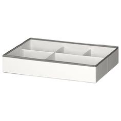 an empty white box with three compartments on the bottom and one drawer in the middle