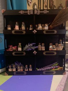 a shelf filled with lots of different types of flowers