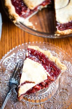 a piece of pie sitting on top of a glass plate