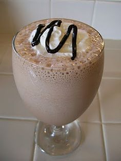 a drink with whipped cream and chocolate on top