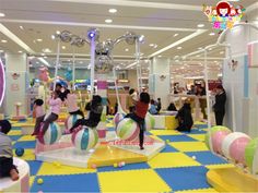 children are playing in an indoor play area