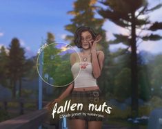 a woman talking on a cell phone while standing in front of trees with the words fallen nuts above her head