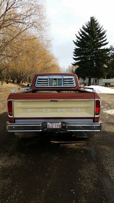 the back end of a pickup truck parked in a driveway