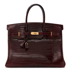 This is the authentic HERMES Shiny Porosus Crocodile Birkin 35 in Rouge H. The creation of this bag was originally a collaboration and an inspiration between the French Hermes and the British actress Jane Birkin. This stunning handbag is featured here in luxurious red crocodile leather. Gold plated hardware is found at the closure straps, lock, and feet. The bag opens to an interior of chevre goatskin leather with zipper and patch pockets. Luxury Purses Hermes Birkin, Burgundy Birkin, Red Birkin Bag, Hermes Bags Birkin, Zimmerman Blouse, Cargo Birkin, Jane Birkin Bag, Birkin Bag Aesthetic, Shoulder Birkin