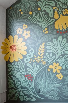 a wall with flowers painted on it