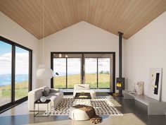 a living room filled with furniture next to a fire place and large windows on the wall