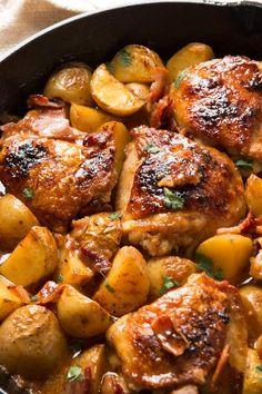 chicken and potatoes in a skillet ready to be eaten