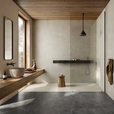 a modern bathroom with two sinks and mirrors