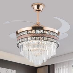 a chandelier hanging from the ceiling in a living room