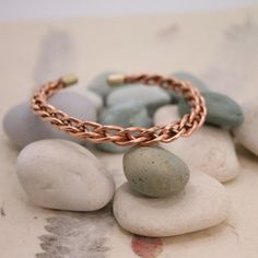 Handmade Pure Copper Bracelet from Nepal - Unique & Timeless Beauty Elevate your style with our Handmade Pure Copper Bracelet from Nepal, a stunning piece meticulously crafted by skilled Nepali artisans. This unique bracelet merges traditional craftsmanship with modern elegance, making it a must-have accessory for any jewelry lover. ✨ Artisan Craftsmanship: Each bracelet is lovingly handcrafted in Kathmandu, showcasing the meticulous attention to detail and skill of our artisans. The warm copper tones and intricate design offer a timeless allure that complements any outfit. 🌍 Experience Nepal's Cultural Heritage: Wearing this bracelet means you're carrying a piece of Nepal's rich artistry and culture. It's a simple yet stylish accessory perfect for any occasion. 📏 Product Details: Size O Bracelets With Meaning, Copper Cuff, Handmade Bangles, Bangle Designs, Unique Bracelets, Copper Bracelet, Healing Bracelets, Cuff Bangles, Pure Copper