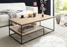 a living room with a white couch and coffee table