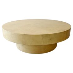 a round wooden table with no top on a white background in the style of art deco