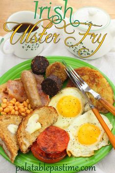 a green plate topped with eggs, sausages and other breakfast foods next to a cup of coffee