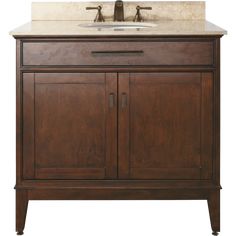 a bathroom vanity with a marble top and two doors on one side, an open drawer under the sink