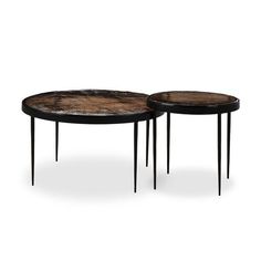 two tables with hair on hide top and metal legs, one is black and the other is brown