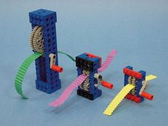 three legos are made to look like they're playing with different colored parts