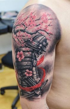 a man's arm with a japanese tattoo on it