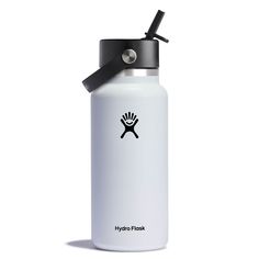 the hydro flask water bottle is white and has a black lid