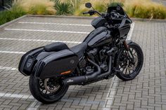 a black motorcycle parked in a parking lot