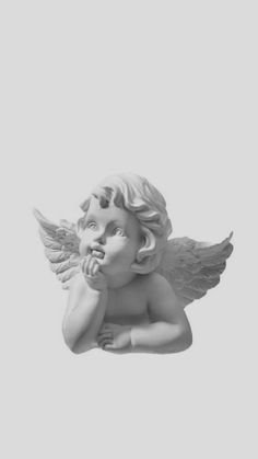 an angel statue is shown against a white background