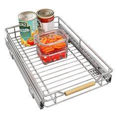 a metal shelf with food in it and two cans on the bottom one is filled with carrots