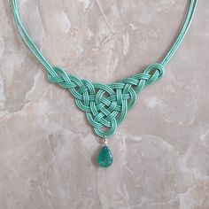 Stunning Celtic knot necklace, handmade with real Chalcedony drop. This gorgeous necklace would be perfect to wear to Renaissance Faires, Irish Festivals or anytime you want to show your Irish pride!  Made from 3 strands of leather cord and a beautiful semiprecious stone, this woven bib necklace is a work of art. About 20 inches long, available in Green or Green/Brown. Handfasting Cords, Irish Festival, Celtic Knot Necklace, Irish Pride, Irish Jewelry, Necklace Green, Celtic Jewelry, Knot Necklace, Green Necklace