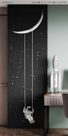 an image of a room with a rocket ship on the wall and moon in the sky