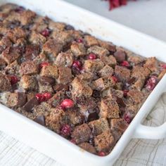 a casserole dish filled with cranberries and chocolate