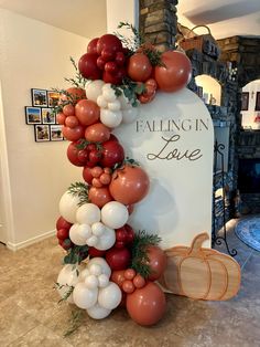 the balloon arch is decorated with tomatoes, onions and other vegetables for a fall wedding