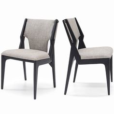 a pair of chairs sitting next to each other