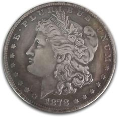 an old silver coin with the head of a woman's face and stars on it