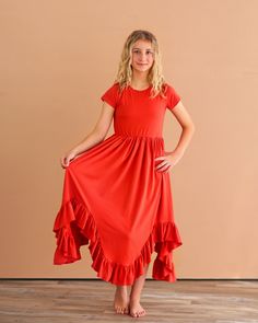 This boho dress with a high-low hem full skirt is perfect for any occasion. Dress it up or down and get ready to twirl! 65% Cotton, 35% polyester We recommend hand washing and hang drying this article of clothing. Casual Flowy Dress With Layered Hem, Spring Ruffled Skirt Dress, Spring Solid Color Dress With Ruffled Skirt, Red Flowy Tiered Skirt Dress, Spring High-low Dress With Ruffles, Red Flowy Tiered Dress, Red High-low Hem Summer Dress, Ruffle Hem Midi Maxi Dress, Summer High-low Hem Dress With Ruffles