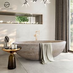 a bathroom with a large bathtub next to a window and a mirror on the wall