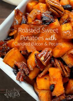 roasted sweet potatoes with candied bacon and pecans in a white dish on a wooden table