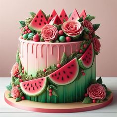 there is a cake decorated with watermelon and roses on the top, as well as flowers