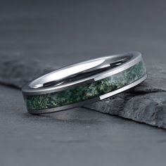 two wedding bands with green marble inlays