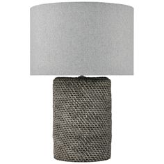 a gray lamp with a white shade on it's base and a grey fabric lampshade