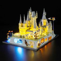 a lego light up castle is shown with its lights turned on and it's in the dark