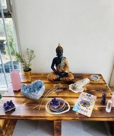 a wooden table topped with lots of different types of rocks and stones on top of it