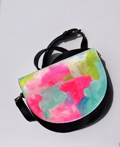 This is a unique piece that I loved creating. I've always been a fan of abstract art and I enjoyed working on this piece. This crossbody purse or wallet is very functional as it has got a couple of card slots, spacious main slots where you can keep your phone and makeup stuff.  Ideal for gifting anyone who likes to use trendy, modern, artistic, fashionable women accessories. This purse will go for almost any dress from robes to jeans.  Perfect gift for birthday, valentine's day, Farewell, Anniversary, Bachelorette party, and graduation, however, you don't actually need an occasion to gift your loved ones. :)  Product details:  --------------------- Features: This purse comes with a flap closure, adjustable shoulder strap,  top flap with button closure. Material: Polyurethane (PU) and polye Artistic Green Shoulder Bag As Gift, Pink Handmade Artistic Bag, Artistic Hand Painted Shoulder Bag For Gift, Handmade Artistic Pink Bag, Artistic Hand Painted Shoulder Bag Gift, Artistic Handmade Pink Bag, Painted Leather Purse, Makeup Stuff, Small Women