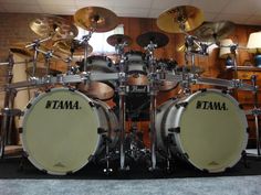 a set of drums sitting on top of a wooden floor