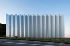 a large white building sitting on the side of a road