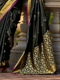 Our gorgeous black zari weaving silk reception wear saree with blouse. Crafted in a striking black color with intricate zari weaving work, this saree exudes elegance and grace. The set includes a matching silk blouse with zari weaving work to complete your traditional look. The saree measures 5.50 meters and the blouse material is unstitched, allowing you to customize the fit according to your measurements.
This saree set includes the luxurious silk fabric that drapes beautifully, making you the Semi-stitched Black Art Silk Blouse Piece, Designer Black Banarasi Silk Saree, Traditional Black Chanderi Saree, Black Art Silk Saree With Pallu, Black Art Silk Saree With Traditional Drape, Black Art Silk Saree With Zari Work, Designer Black Tussar Silk Saree, Black Dupatta With Zari Weaving For Designer Wear, Black Art Silk Saree For Diwali