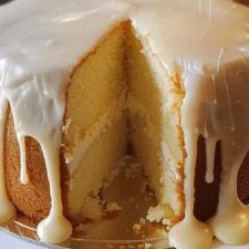 a cake with white icing on a plate