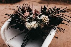 a bouquet of flowers sitting on top of a white chair