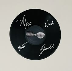 a record with autographs written on it