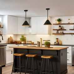 a kitchen with two bar stools next to an island